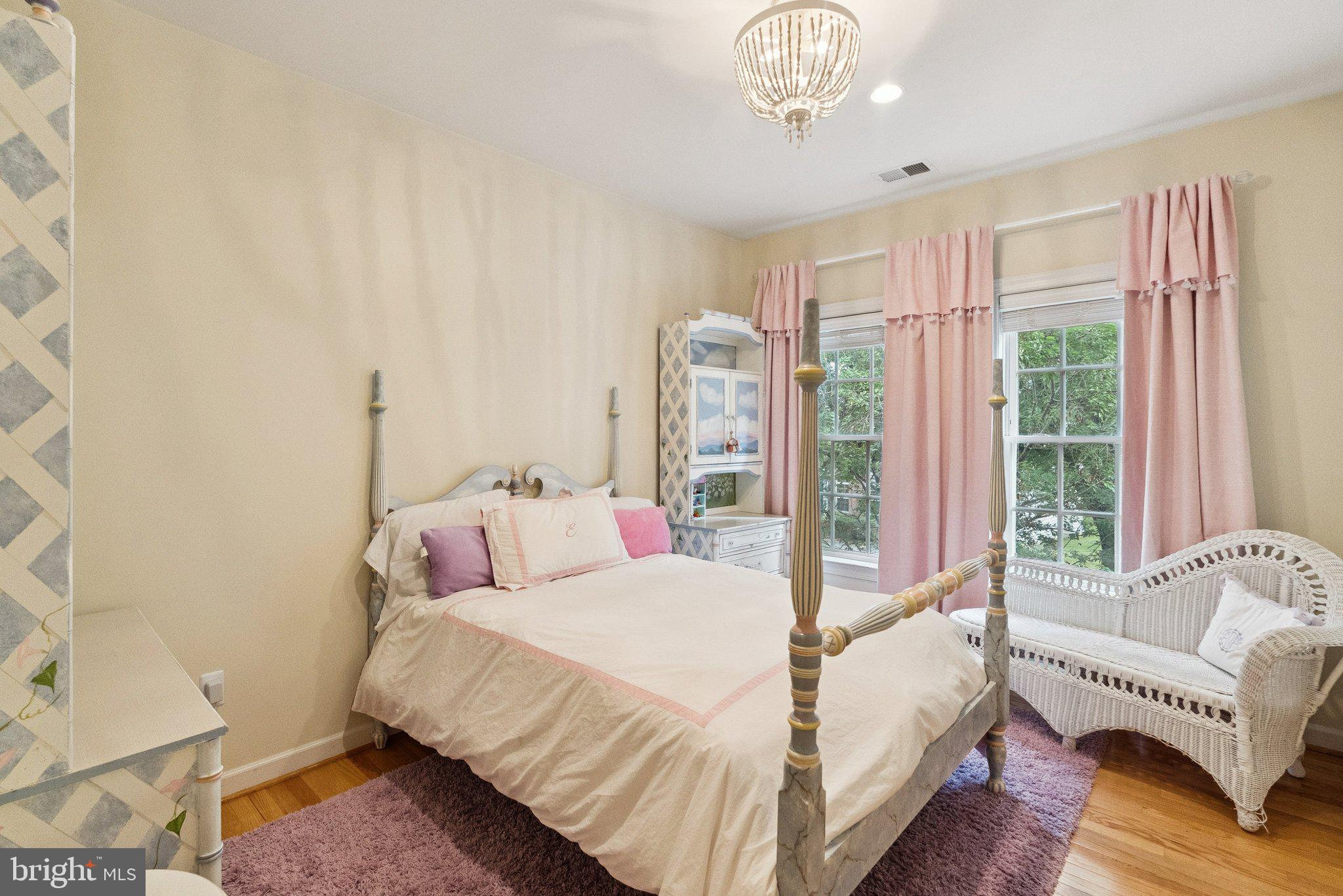 503 Autumn Wind Way Rockville, MD 20850 - Photo 40 of 83 a bedroom with a bed and a chandelier