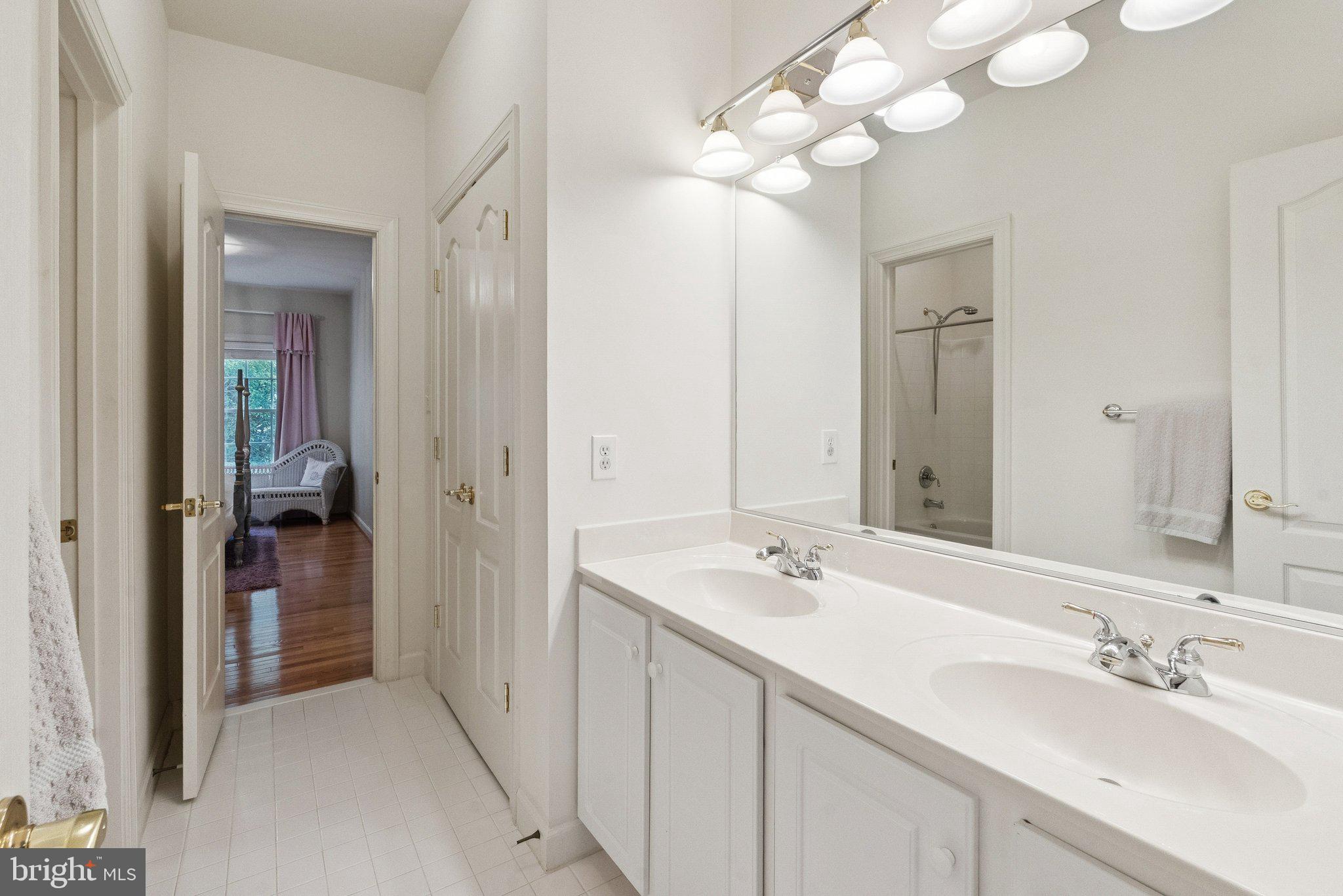 503 Autumn Wind Way Rockville, MD 20850 - Photo 42 of 83 a bathroom with a sink vanity and a mirror