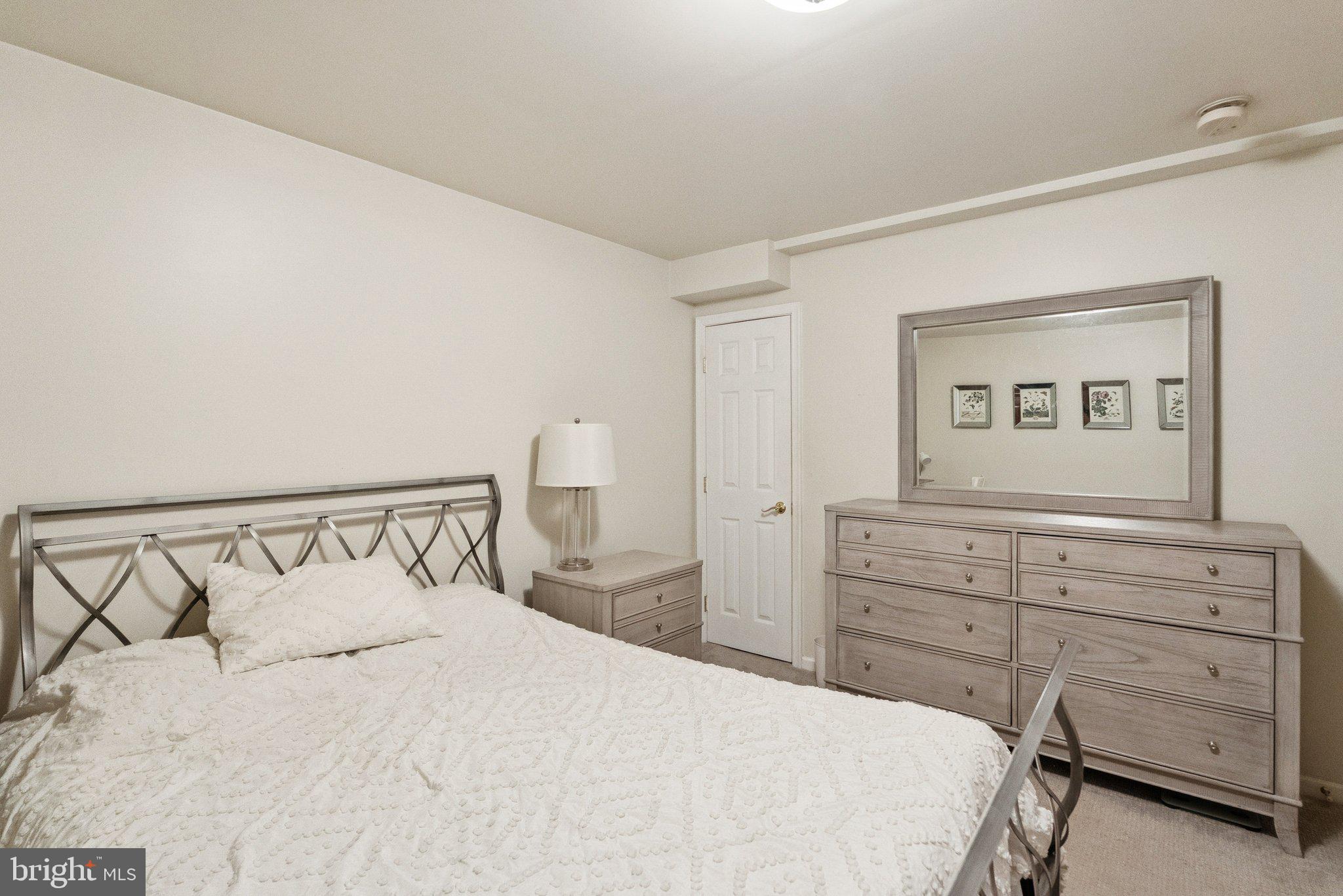 503 Autumn Wind Way Rockville, MD 20850 - Photo 47 of 83 a bedroom with a bed and a dresser