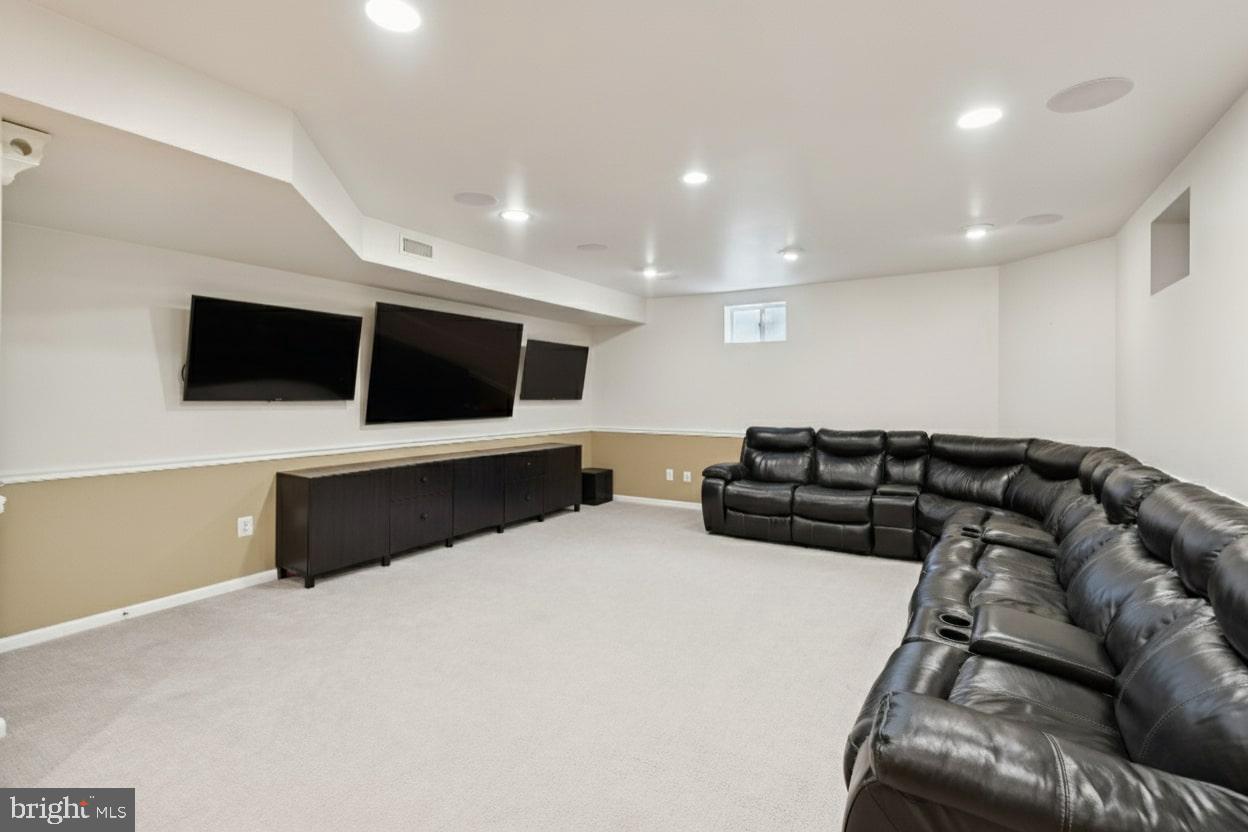 503 Autumn Wind Way Rockville, MD 20850 - Photo 51 of 83 a living room with furniture and a flat screen tv