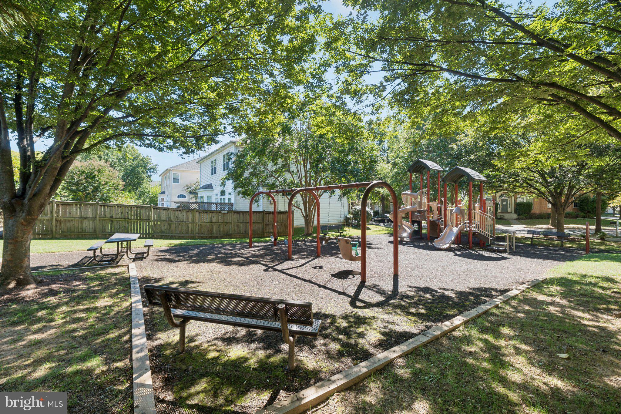 503 Autumn Wind Way Rockville, MD 20850 - Photo 64 of 83 a view of a patio with table and chairs and a large tree