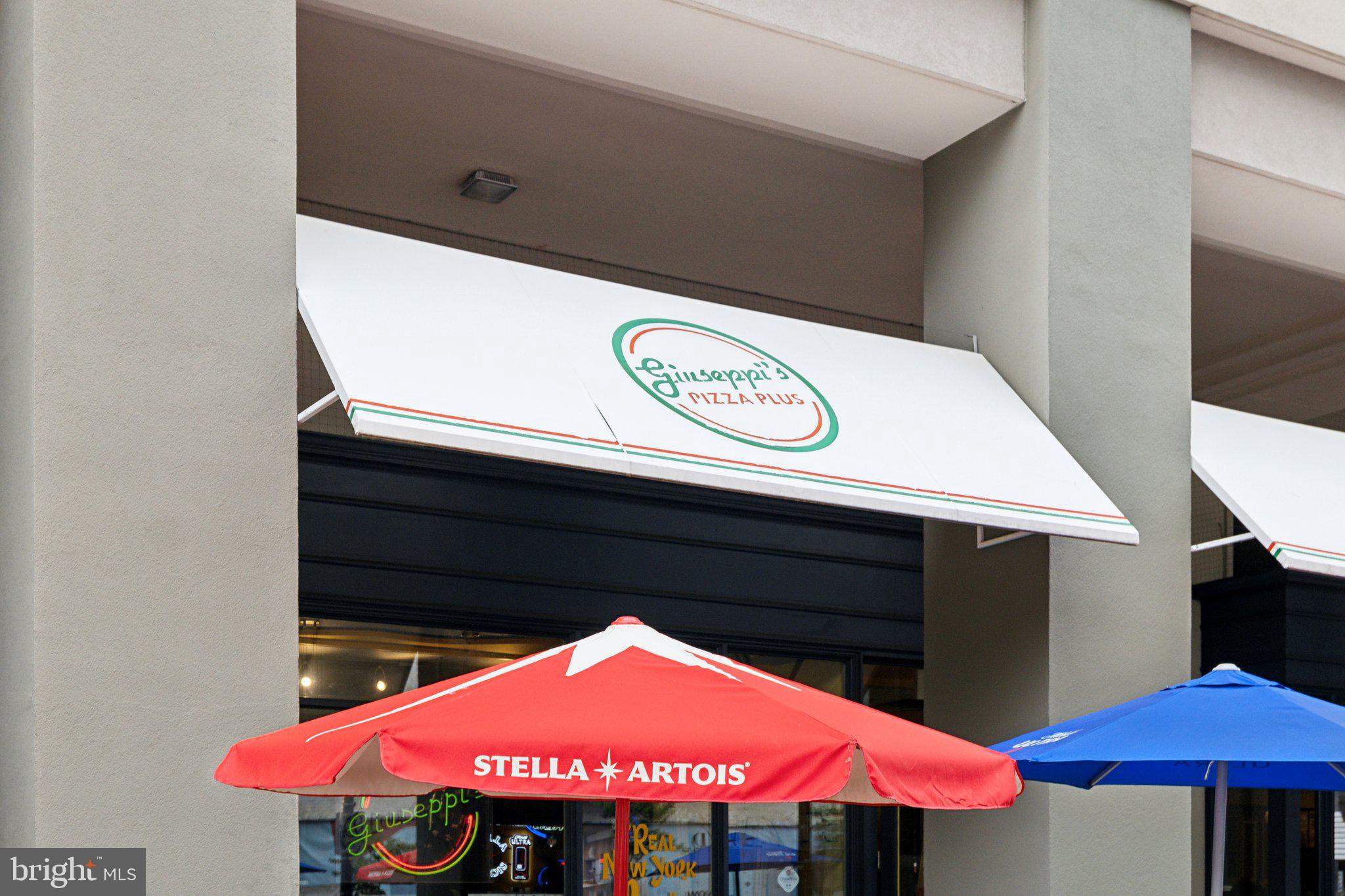 503 Autumn Wind Way Rockville, MD 20850 - Photo 73 of 83 a view of a table and chairs under an umbrella