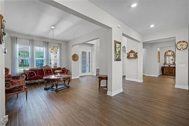 a large kitchen with stainless steel appliances and a sink