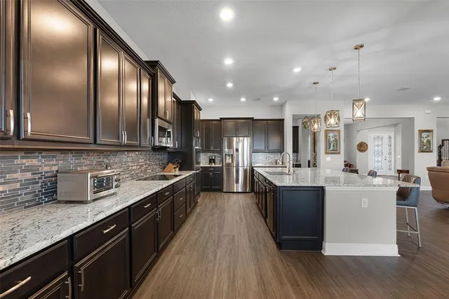 a bed sitting in a spacious bedroom next to a window