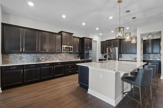 a bathroom with a sink toilet and mirror