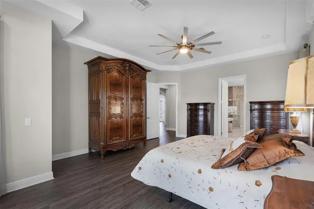 a bed room with a bed and a chair