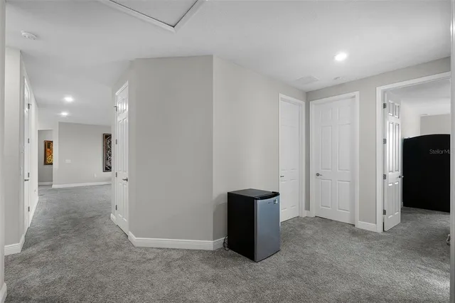 an aerial view of residential houses with outdoor space and swimming pool