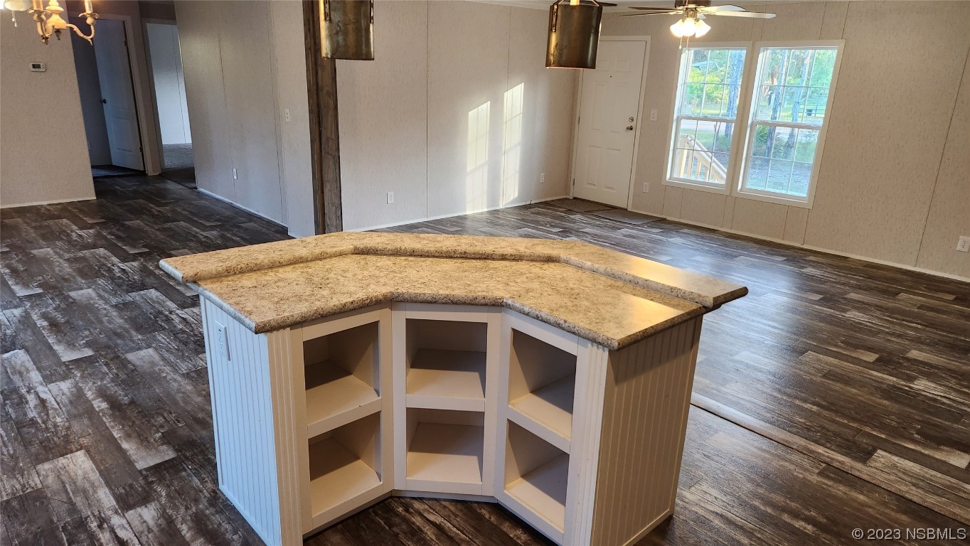 6262 Cherry Lane Bunnell, FL 32110 - Photo 21 of 41 a kitchen with a stove and a wooden floor