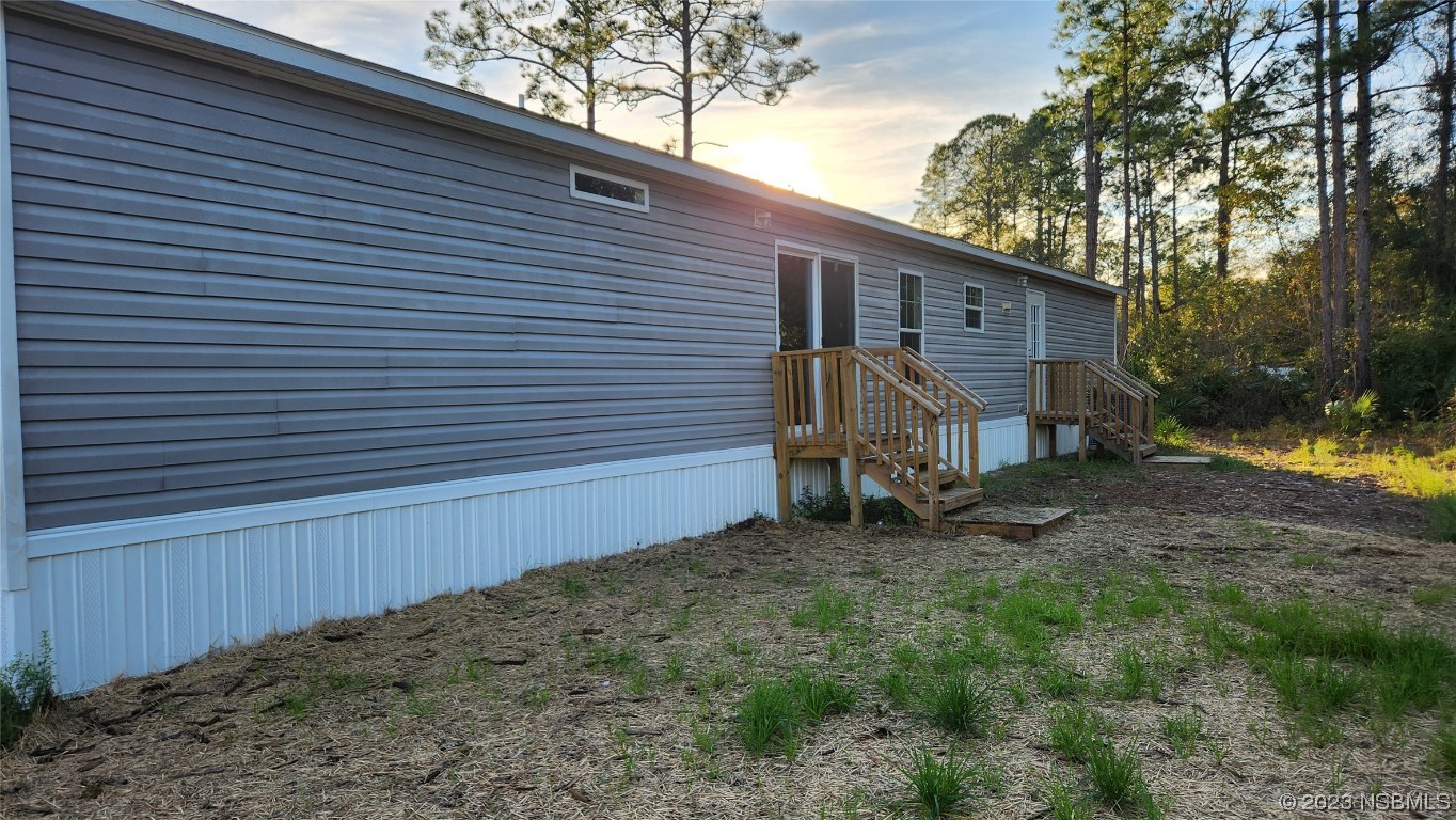 6262 Cherry Lane Bunnell, FL 32110 - Photo 28 of 41 a view of a small house and a yard