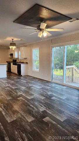 a view of a room with a large window