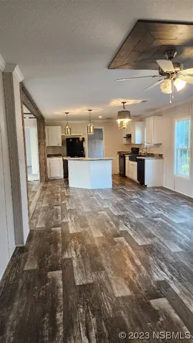 a view of a kitchen with a sink