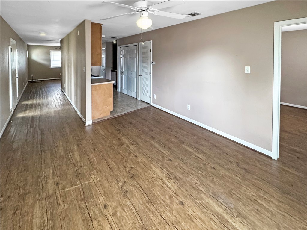 1601 South College Avenue, Unit 5 Bryan, TX 77801 - Photo 3 of 6 a view of a hallway with wooden floor