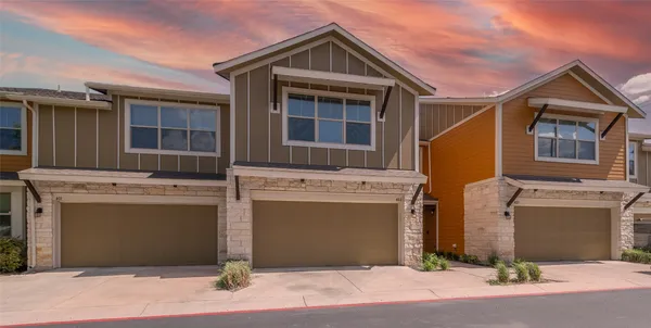 a view of house with garage