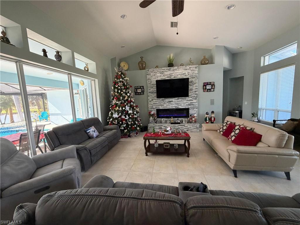 7791 Grande Pine Road Bokeelia, FL 33922 - Photo 36 of 45 a living room with furniture and a flat screen tv