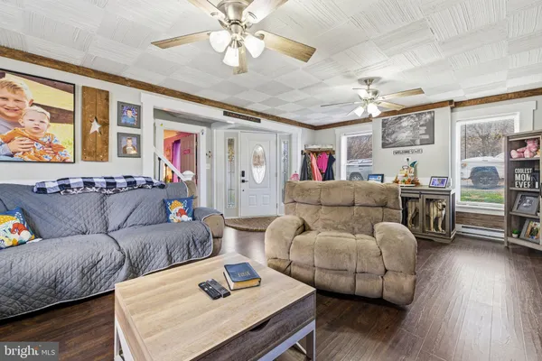 a bedroom with furniture and a chandelier