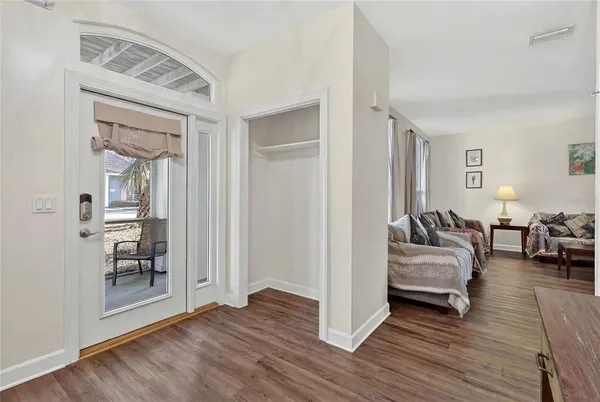 a living room with a couch and a window