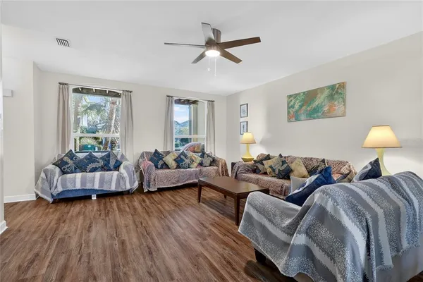 a view of a dining room with furniture and wooden floor