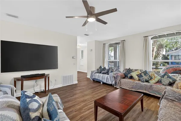 a view of a dining room with furniture window and wooden floor