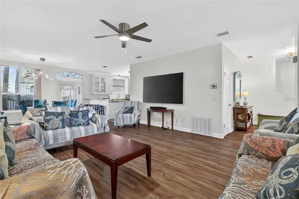 a view of a dining room with furniture and wooden floor