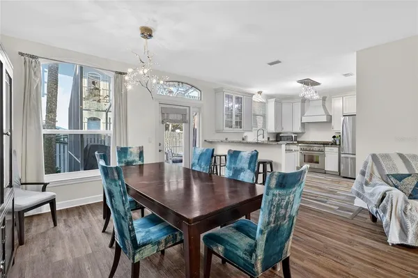 a kitchen with kitchen island granite countertop a sink appliances cabinets and counter space