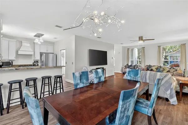 a kitchen with a sink dishwasher window and cabinets
