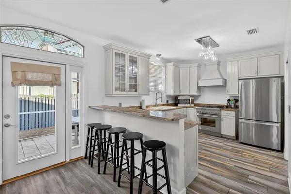 a view of hallway with wooden floor