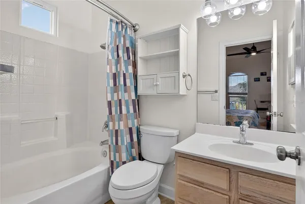 a view of a livingroom with furniture wooden floor and windows