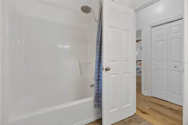 an aerial view of residential houses with outdoor space and swimming pool