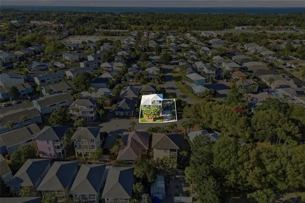 an aerial view of house with yard