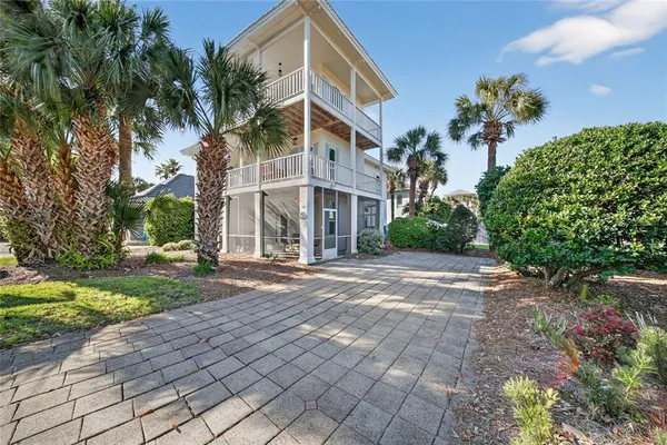 a view of a fountain in front of a house