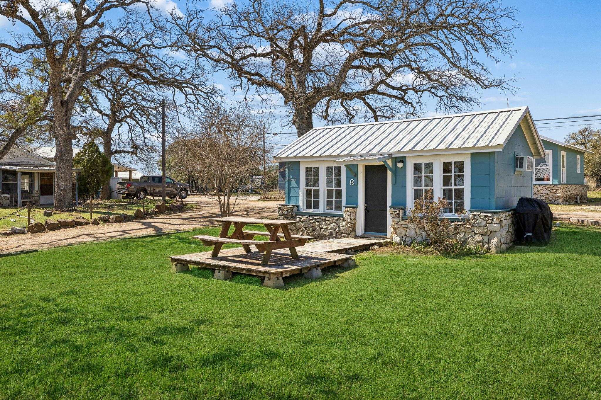 16838 Rm 2241 Tow, TX 78672 - Photo 11 of 30 a front view of a house with a yard table and seating