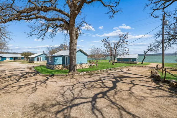 a view of a house with a big yard