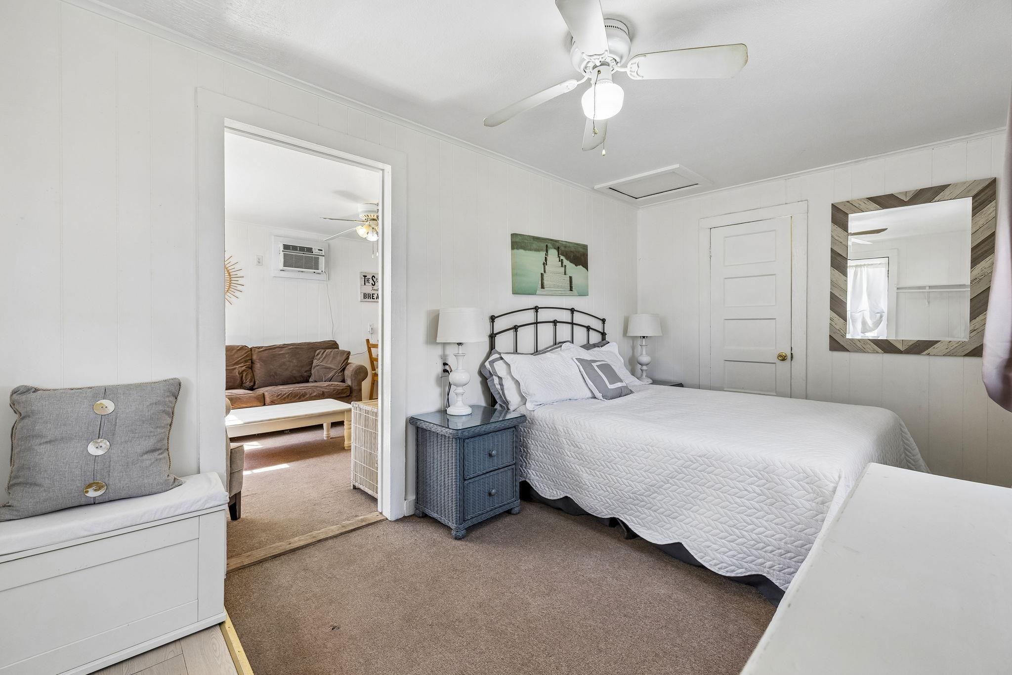16838 Rm 2241 Tow, TX 78672 - Photo 20 of 30 a bedroom with a white bed and ceiling fan