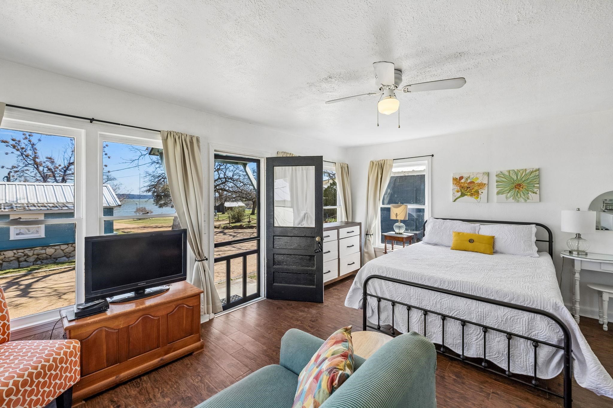 16838 Rm 2241 Tow, TX 78672 - Photo 22 of 30 a bedroom with furniture and a flat screen tv