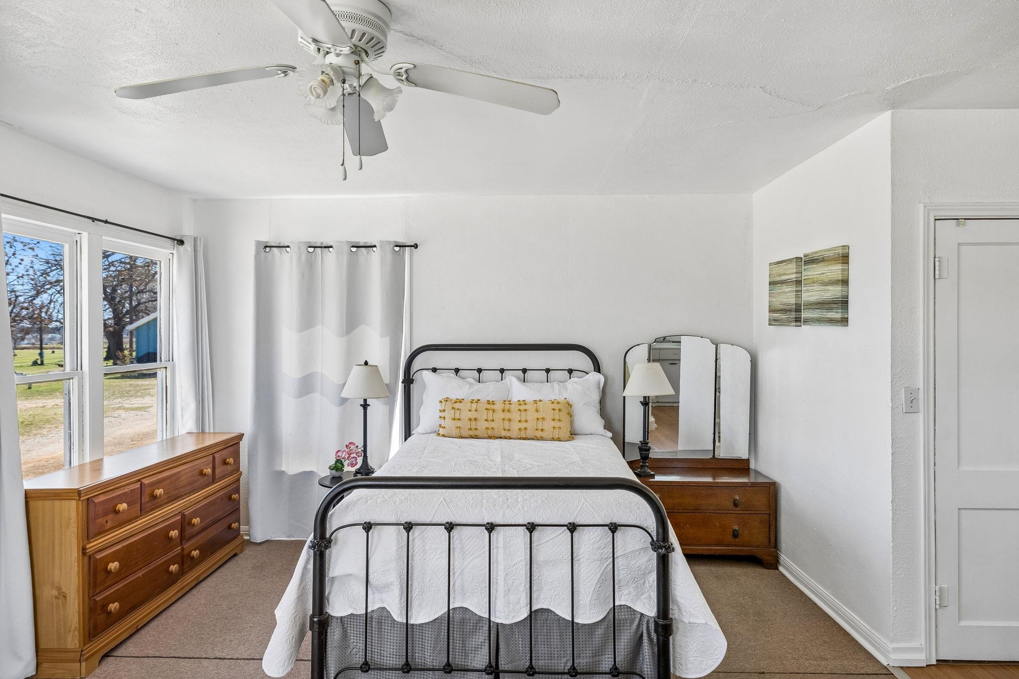 16838 Rm 2241 Tow, TX 78672 - Photo 23 of 30 a bed sitting in a bedroom next to a window
