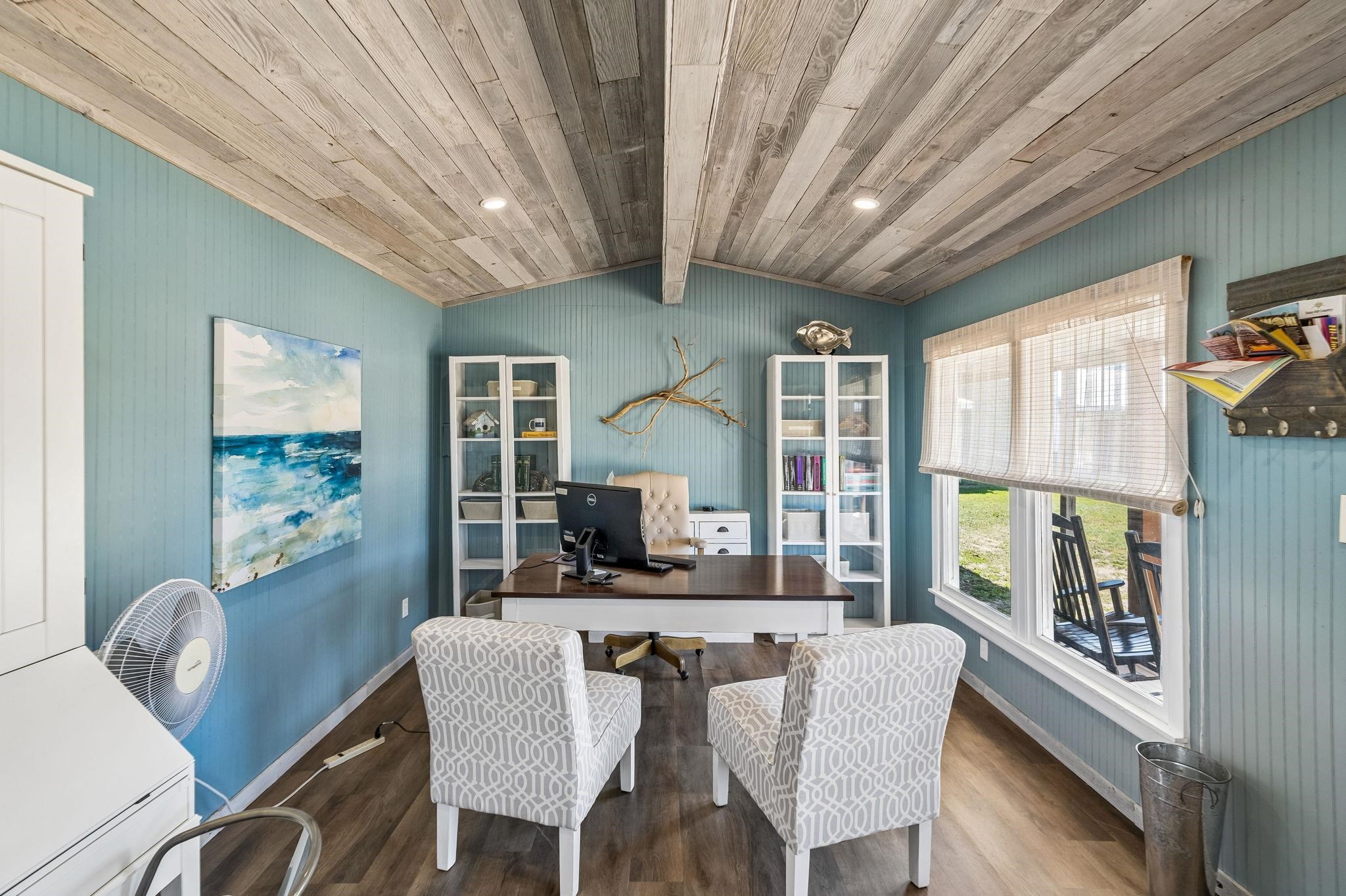 16838 Rm 2241 Tow, TX 78672 - Photo 26 of 30 a dining room with furniture large windows and wooden floor