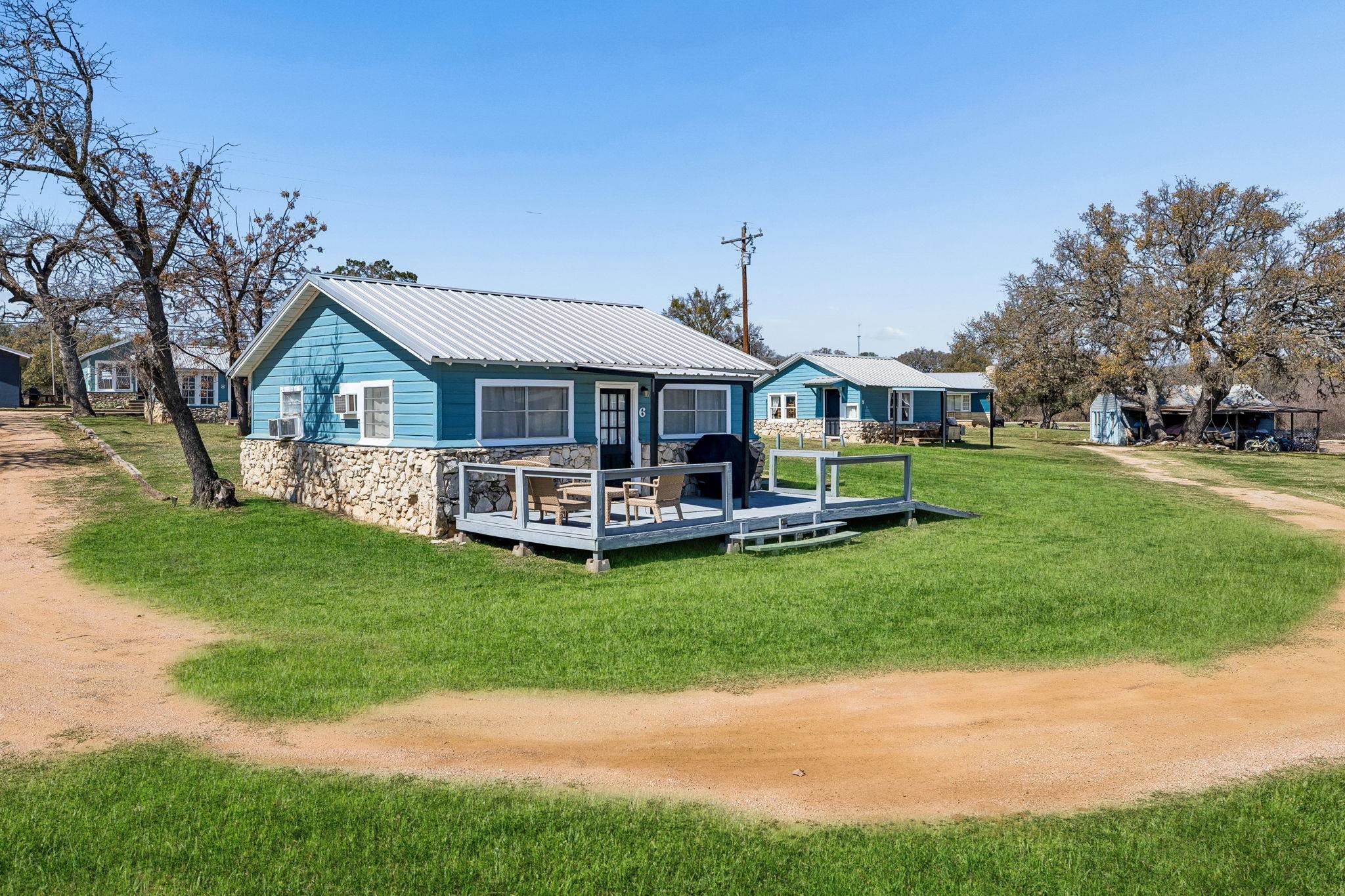 16838 Rm 2241 Tow, TX 78672 - Photo 10 of 30 a front view of a house with a garden and trees