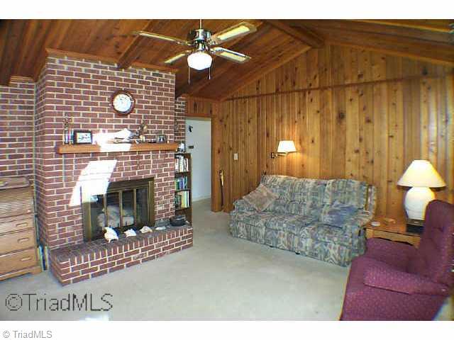 8075 Haw River Road Stokesdale, NC 27310 - Photo 2 of 9 Other. Beautiful wood panelled den with fireplace