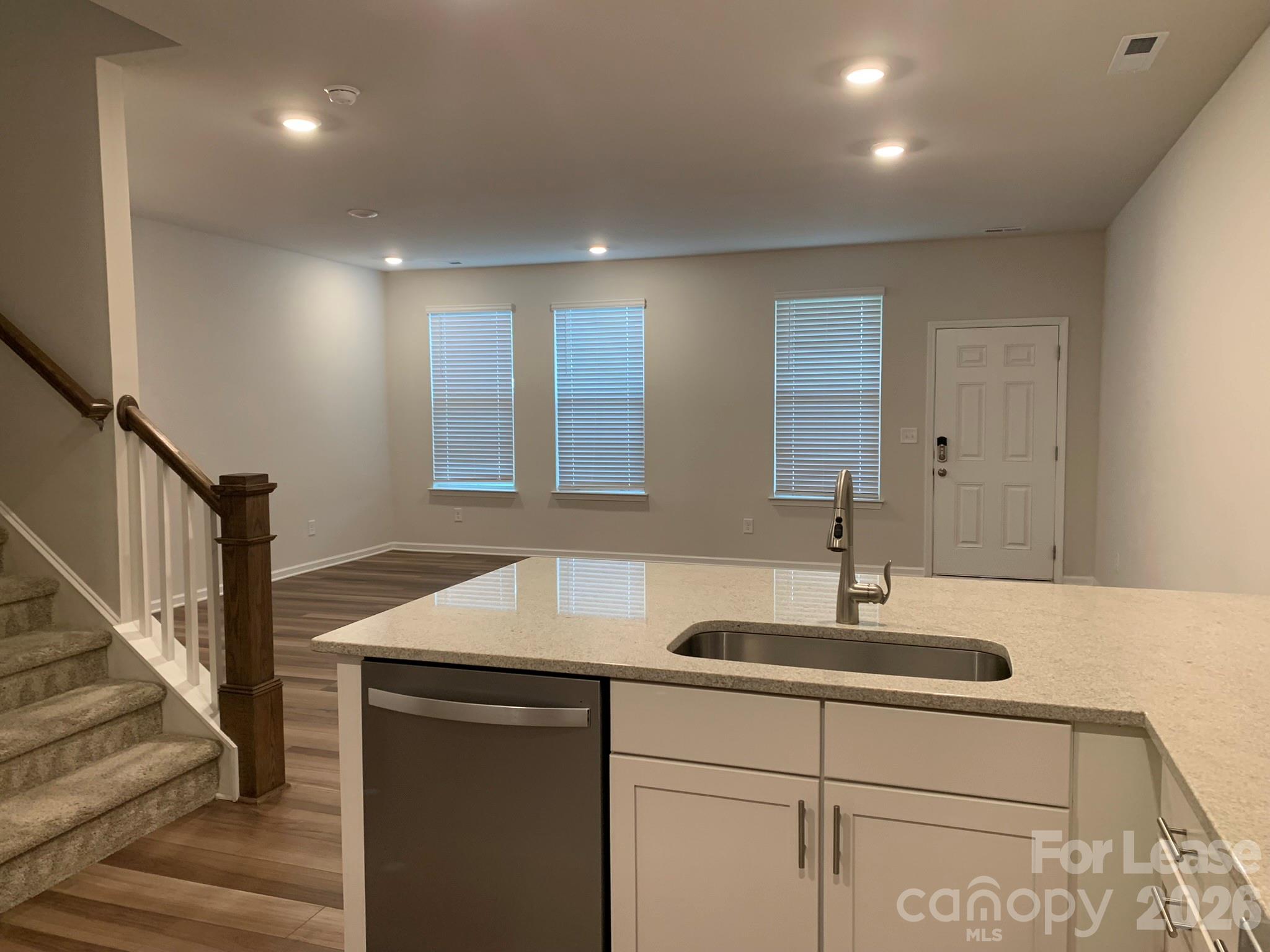 2143 Stevens Mill Road Matthews, NC 28104 - Photo 6 of 39 a kitchen with sink and mirror