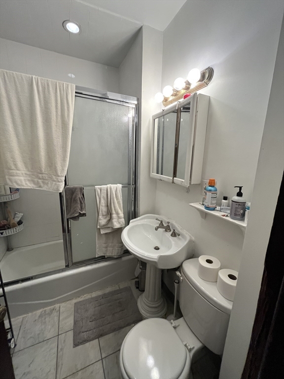 142 St Alphonsus Street, Unit 3 Boston, MA 02120 - Photo 11 of 13 a bathroom with a sink a toilet and shower