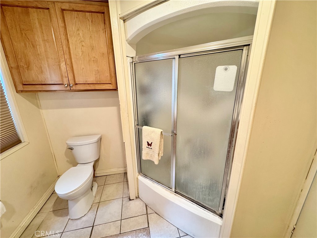 23301 Ridge Rte Drive, Unit 109 Laguna Hills, CA 92653 - Photo 29 of 46 a bathroom with a toilet and a shower