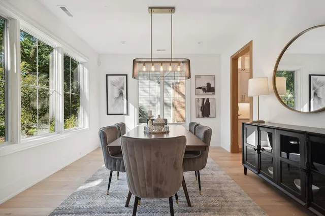 a view of living room kitchen and a wooden floor