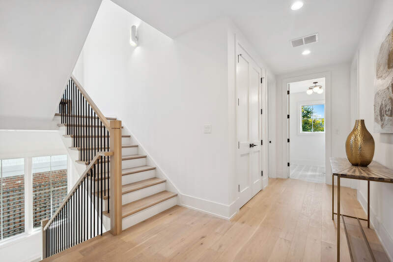 1209 Maple Avenue Wilmette, IL 60091 - Photo 24 of 28 a view of a hallway with wooden floor and staircase