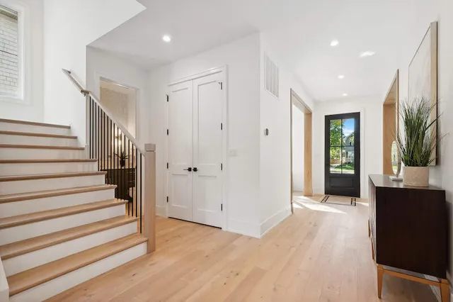 a living room with fireplace furniture and a wooden floor