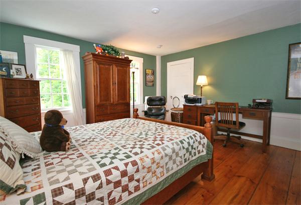 52 Salem Street Andover, MA 01810 - Photo 13 of 21 a bedroom with a bed and wooden floor