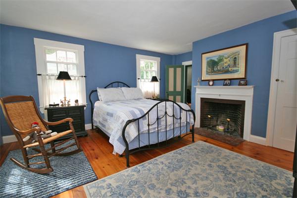52 Salem Street Andover, MA 01810 - Photo 16 of 21 a bedroom with a bed and a fireplace