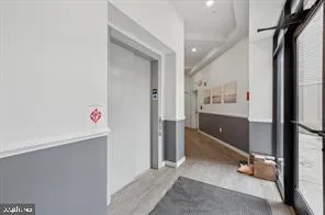 a room with gym equipment and a view of living room