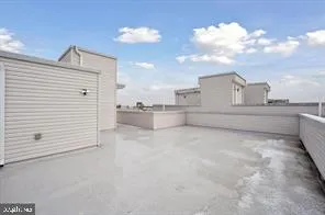 a car parked in front of a car parked in front of a building