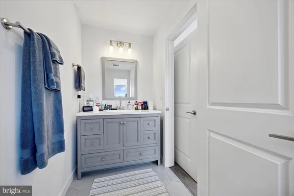 a bathroom with a double vanity sink and mirror