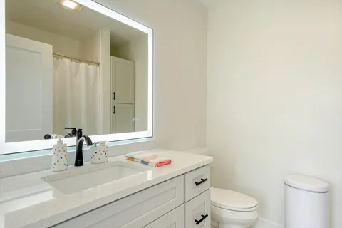 a bathroom with a sink a toilet and a bathtub